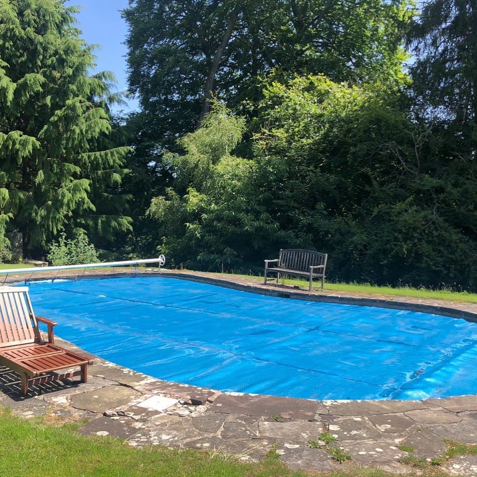 Danby Lodge Pool with forest background